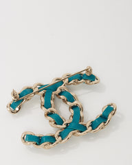Chanel Silver Metal and Turquoise Blue Leather and Pearl Interwoven CC Logo Brooch